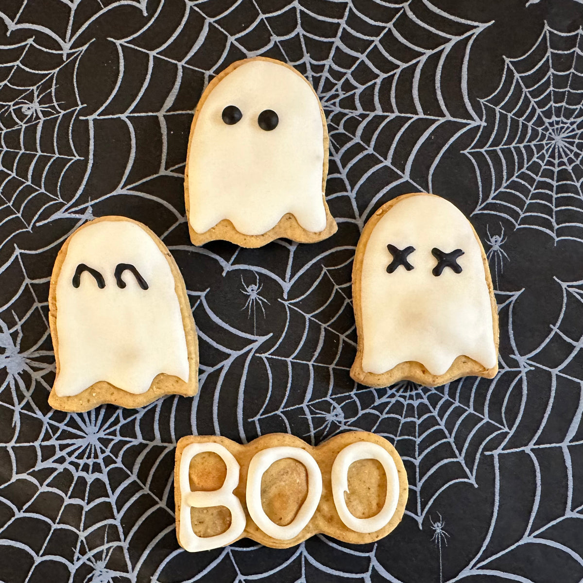 Halloween dog biscuit set with three ghosts and one BOO biscuit