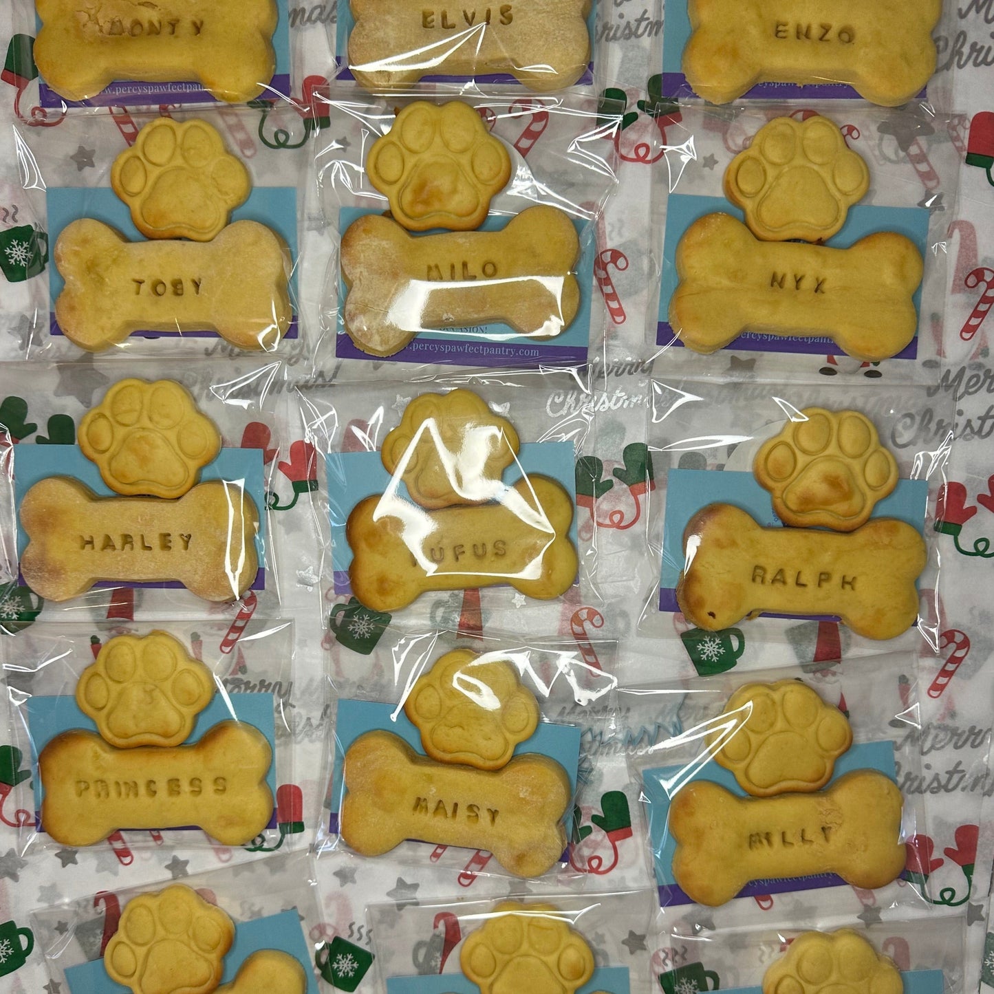 A selection of  mini paw and dog bone biscuit stamped with dogs name