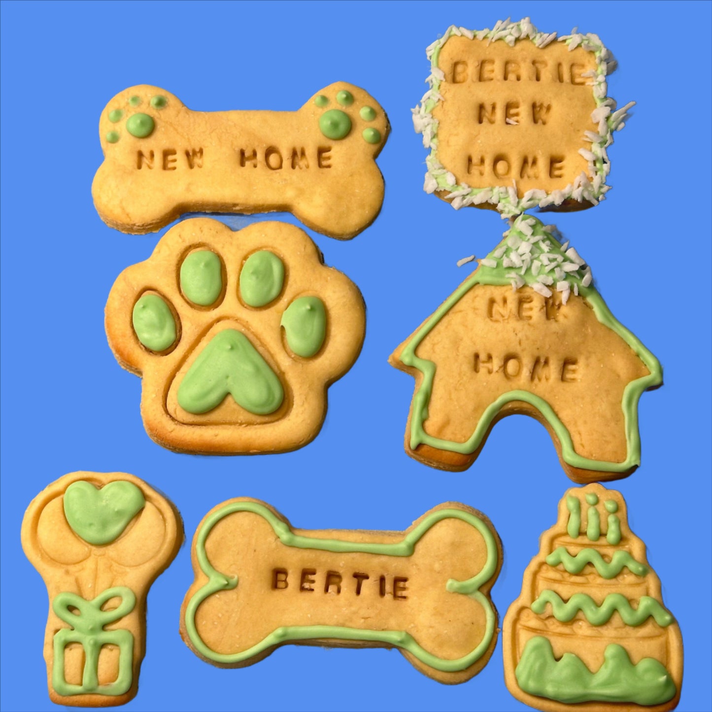A collection of colourful dog treats with various decorations such as bones, paws