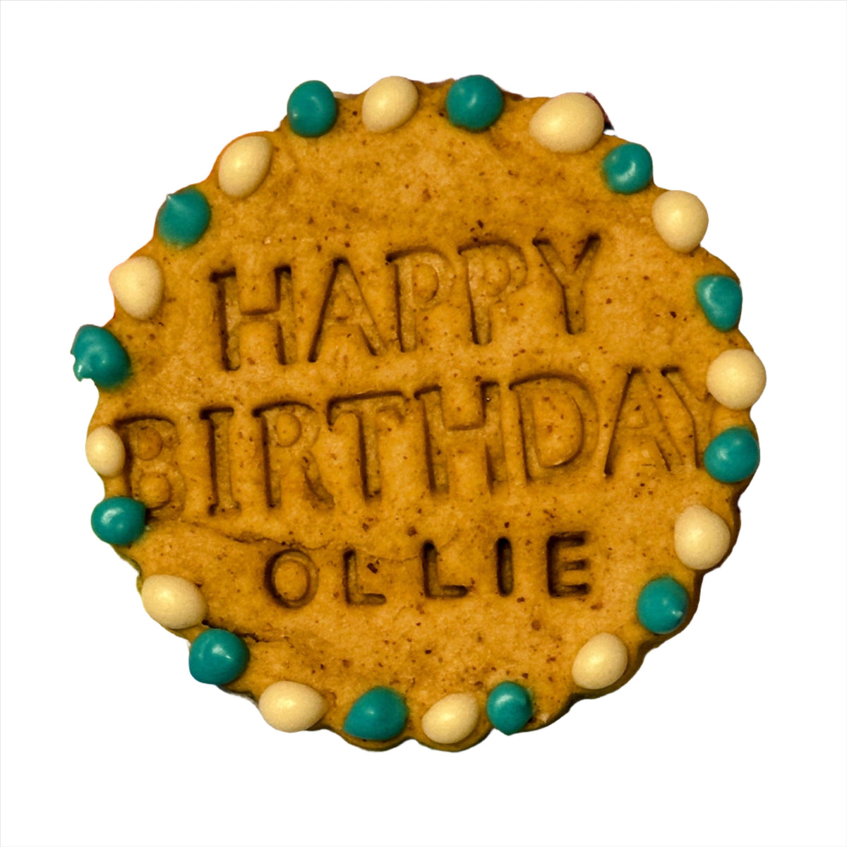A single dog biscuits with "Happy Birthday Ollie" stamped on them decorated with blue and white dots