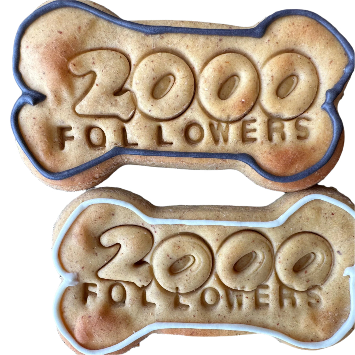 Two personalised Instagram milestone dog biscuits stamped 2000 Followers
