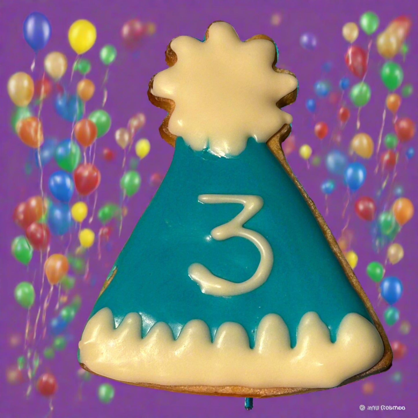 Party hat dog biscuit with blue and white icing