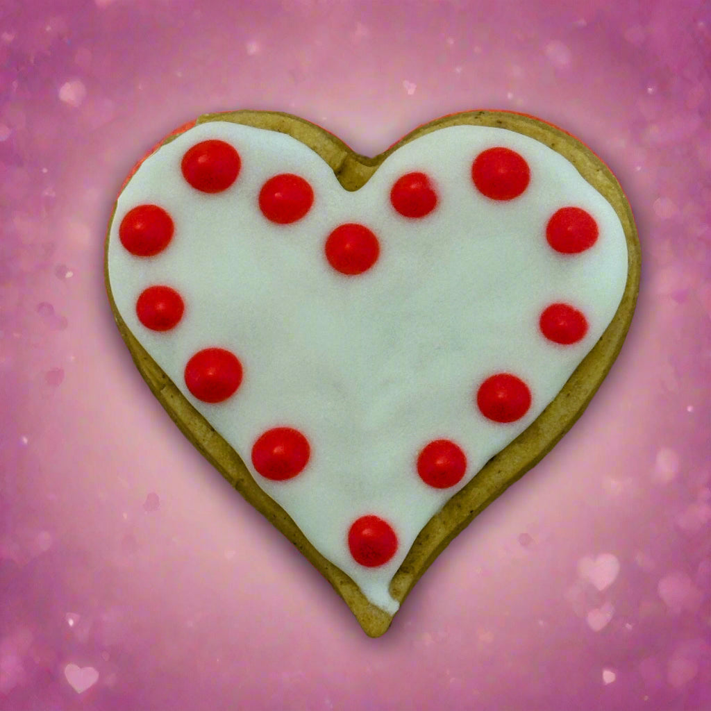 Large heart-shaped dog biscuit with red and white icing