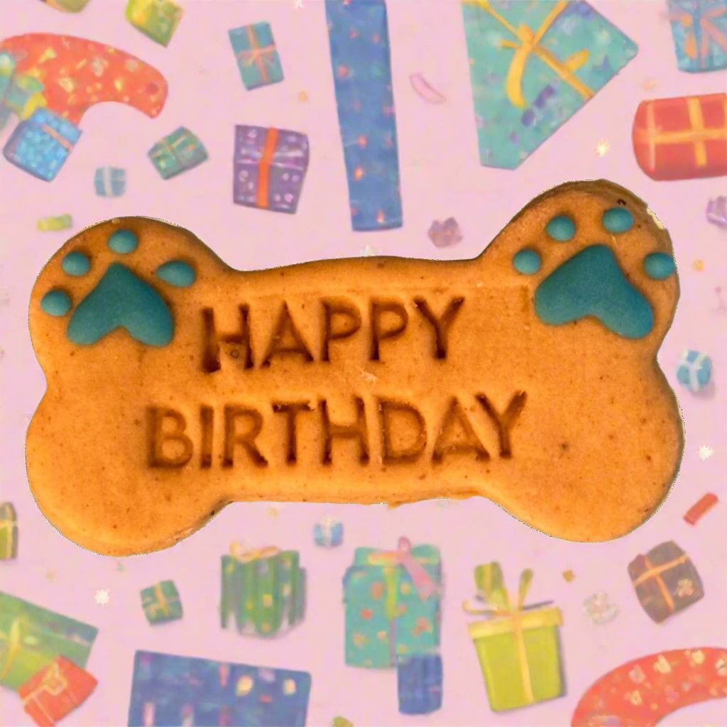 Happy Birthday bone dog biscuit with paw print decorations