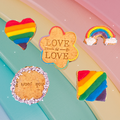 Colourful cookies with rainbow designs and 'Love is Love' text on a pastel background