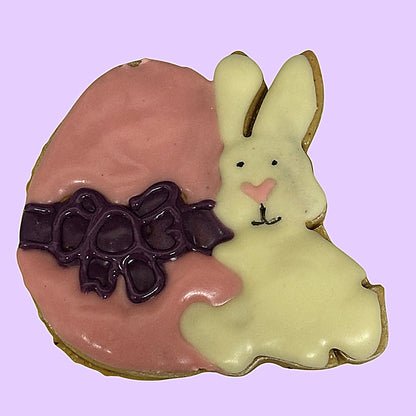 Decorative cookie shaped like a rabbit with pink background