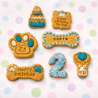 Dog birthday cookies with text and decorations on a polka dot background