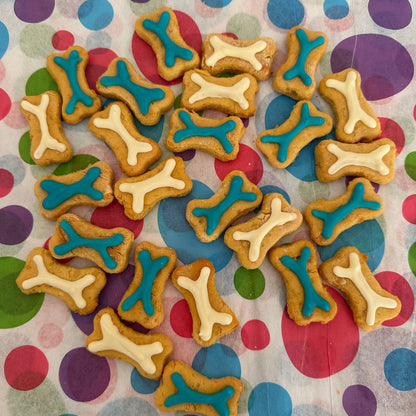 A selection of mini bone biscuits with blue and white icing