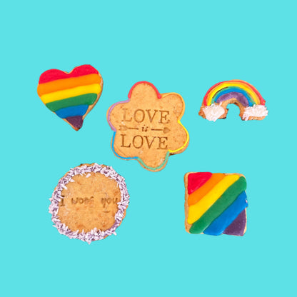 Five colourful cookies with rainbow designs and 'LOVE IS LOVE' text on a blue background