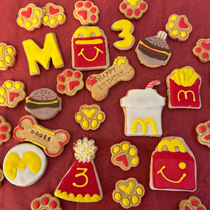 Collection of themed cookies on a red background