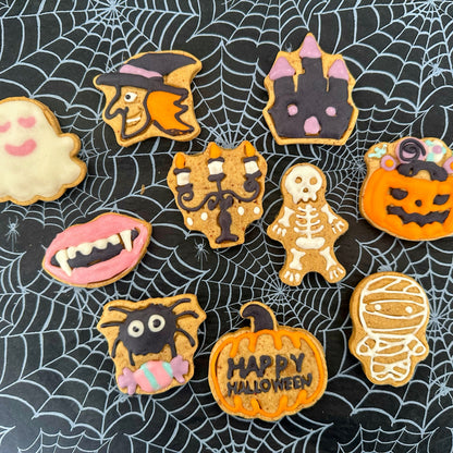 Halloween-themed cookies on a spider web background