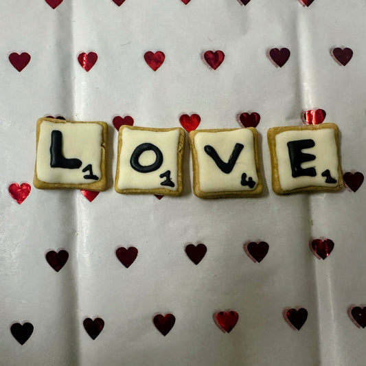 Scrabble letter dog biscuits spelling love