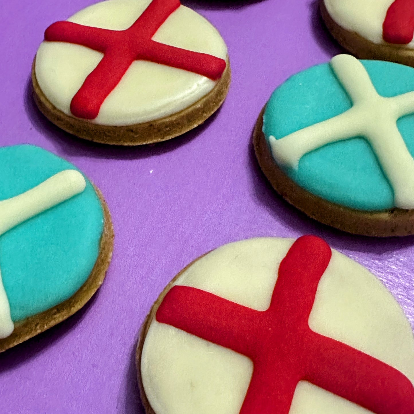 Football-themed dog biscuits decorated as Scotland and England flags, handmade grain-free dog treats for match days, football celebrations and World Cup supporters.