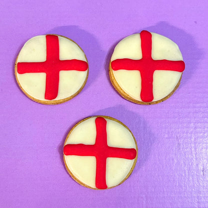 England flag dog biscuits for dogs, handmade and decorated with red and white icing. Grain-free football-themed treats perfect for match days and celebrations.