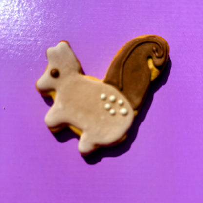 Cookie shaped like a Squirrel on a purple background