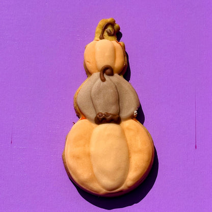 Decorative gourd with three tiers on a purple background