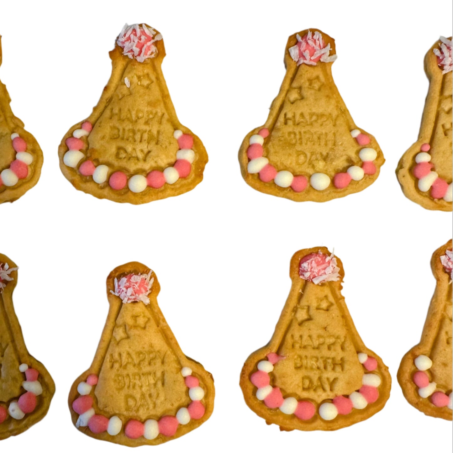 Biscuit cookies shaped like birthday hats with 'Happy Birthday' text on a white background