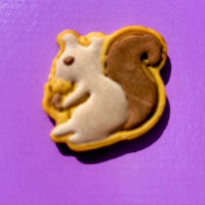 Squirrel-shaped cookie on a purple background